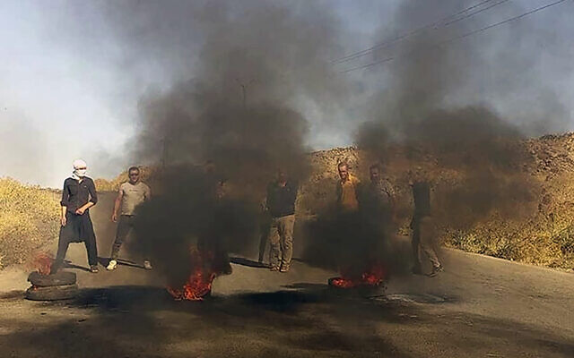 In this photo released by Suwayda24, people stage a protest in the southern city of Sweida, Syria, August 22, 2023. (Suwayda24 via AP) In this photo released by Suwayda24, people stage a protest in the southern city of Sweida, Syria, August 22, 2023. (Suwayda24 via AP)