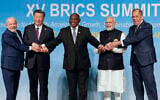 From left, Brazil's President Luiz Inacio Lula da Silva, China's President Xi Jinping, South Africa's President Cyril Ramaphosa, India's Prime Minister Narendra Modi and Russia's Foreign Minister Sergei Lavrov pose for a BRICS group photo during the 2023 BRICS Summit at the Sandton Convention Centre in Johannesburg, South Africa, August 23, 2023. (Gianluigi Guercia/Pool via AP)