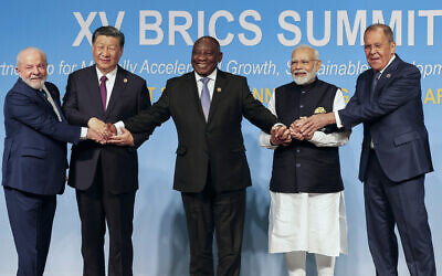From left, Brazil's President Luiz Inacio Lula da Silva, China's President Xi Jinping, South Africa's President Cyril Ramaphosa, India's Prime Minister Narendra Modi and Russia's Foreign Minister Sergei Lavrov pose for a BRICS group photo during the 2023 BRICS Summit at the Sandton Convention Centre in Johannesburg, South Africa, August 23, 2023. (Gianluigi Guercia/Pool via AP)