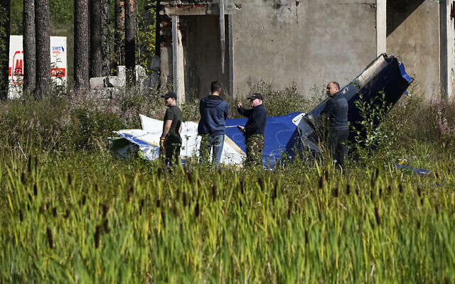 Russian servicemen inspect a part of a crashed private jet near the village of Kuzhenkino, Tver region, Russia, August 24, 2023. (AP Photo/Alexander Zemlianichenko) Russian servicemen inspect a part of a crashed private jet near the village of Kuzhenkino, Tver region, Russia, August 24, 2023. (AP Photo/Alexander Zemlianichenko)