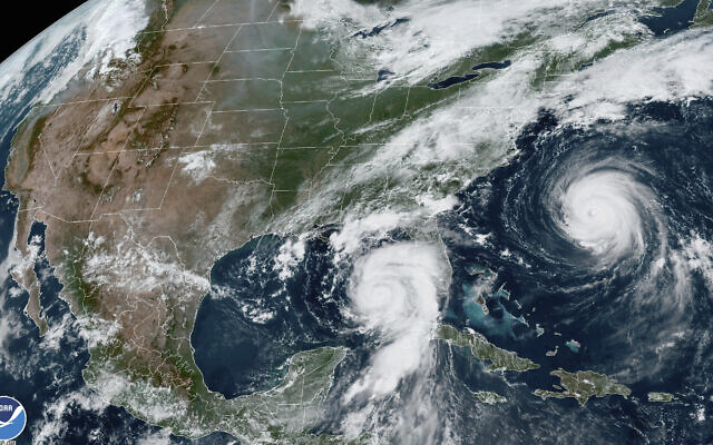 This August 29, 2023, 1:31 p.m. EDT satellite image provided by the US National Oceanic and Atmospheric Administration shows Hurricane Idalia, center, approaching Florida's Gulf Coast, and Hurricane Franklin, right, as it moves along the East Coast of the United States, southwest of Bermuda. (NOAA via AP) This August 29, 2023, 1:31 p.m. EDT satellite image provided by the US National Oceanic and Atmospheric Administration shows Hurricane Idalia, center, approaching Florida's Gulf Coast, and Hurricane Franklin, right, as it moves along the East Coast of the United States, southwest of Bermuda. (NOAA via AP)