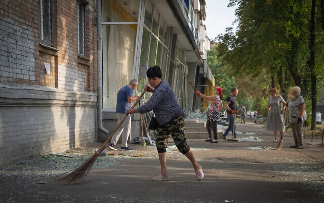 Local residents clean the street from broken glass that fell down from the windows of their apartments and shops after Russian rocket attack in Kyiv, Ukraine, August 30, 2023. Efrem Lukatsky/AP) Local residents clean the street from broken glass that fell down from the windows of their apartments and shops after Russian rocket attack in Kyiv, Ukraine, August 30, 2023. Efrem Lukatsky/AP)