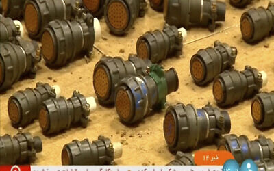 In this image taken from Iran's IRINN television channel on August 31, 2023, authorities show what they say are foreign defective parts that can be used in a missile or drone. (IRINN via AP)