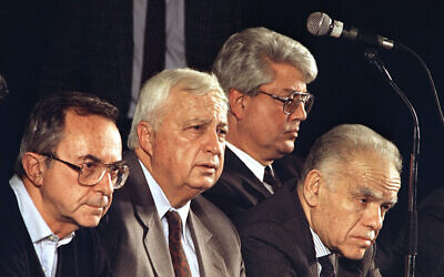 FILE: Leaders of Israeli Likud ruling party, left to right, Defense Minister Moshe Arens, Housing Minister Ariel Sharon, Foreign Minister David Levy and Prime Minister Yitzhak Shamir sit in Tel Aviv, February 10, 1992 at the first of three Likud Party conventions designed to rank Likud's candidates for the upcoming June Israeli elections. (AP Photo/Nati Harnik)