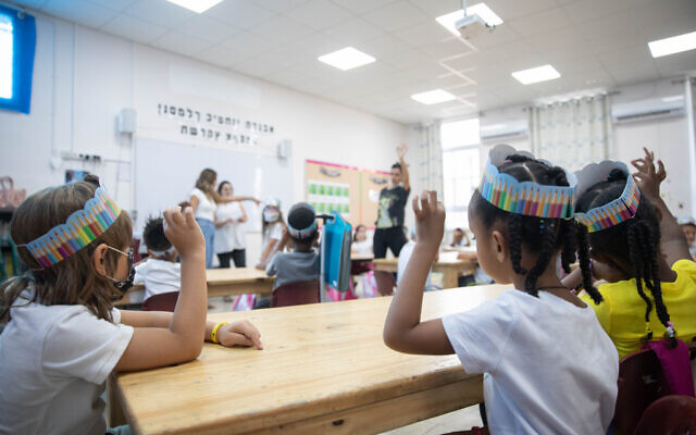 Illustrative: First grade students sit in a classroom on their first day of school, at the Tali Geulim school in Jerusalem on September 1, 2020. (Noam Revkin Fenton/Flash90) Illustrative: First grade students sit in a classroom on their first day of school, at the Tali Geulim school in Jerusalem on September 1, 2020. (Noam Revkin Fenton/Flash90)