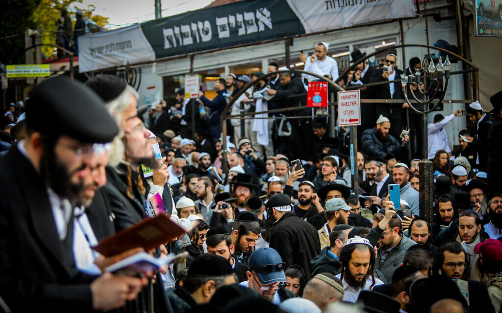 Jewish men in the street near the tomb of Rabbi Nachman of Breslov in Uman, on the eve of Rosh Hashanah, September 25, 2022. (Flash90)