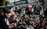 Jewish men in the street near the tomb of Rabbi Nachman of Breslov in Uman, on the eve of Rosh Hashanah, September 25, 2022. (Flash90)