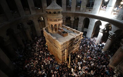 Christian worshippers take part in the Holy Fire ceremony at the Church of the Holy Sepulchre in Jerusalem's Old City during the Easter holiday on April 15, 2023 (Photo by Jamal Awad/Flash90)
