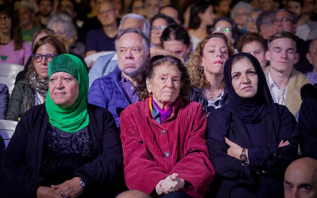 Palestinians and Israelis attend a joint ceremony for families of victims of both sides of the conflict on Israeli Memorial Day, organized by Combatants for Peace and the Parents Circle-Families Forum (PCFF) in Tel Aviv on April 24, 2023. (Itai Ron/Flash90) Palestinians and Israelis attend a joint ceremony for families of victims of both sides of the conflict on Israeli Memorial Day, organized by Combatants for Peace and the Parents Circle-Families Forum (PCFF) in Tel Aviv on April 24, 2023. (Itai Ron/Flash90)