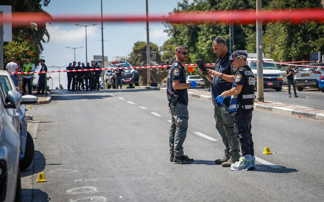 Illustrative: Forensic examiners investigate the crime scene where a man was shot and killed, in Haifa, July 6, 2023. (Shir Torem/Flash90) Illustrative: Forensic examiners investigate the crime scene where a man was shot and killed, in Haifa, July 6, 2023. (Shir Torem/Flash90)