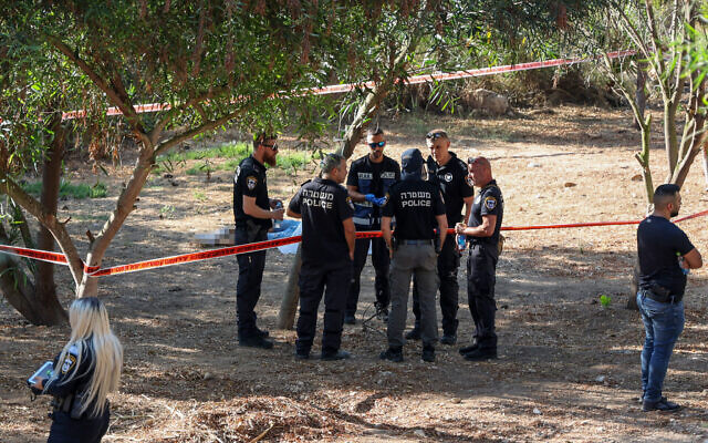 Police at the scene where a man shot his adopted son in Maccabim, on July 14, 2023. (Jonathan Shaul/Flash90) Police at the scene where a man shot his adopted son in Maccabim, on July 14, 2023. (Jonathan Shaul/Flash90)