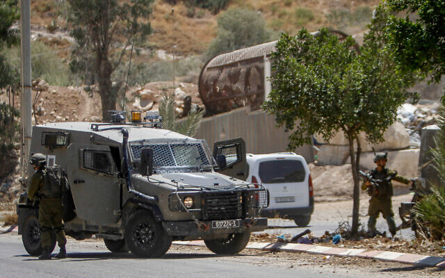 Israeli soldiers near the scene of a terror shooting in the Jordan Valley on August 2, 2023. (Nasser Ishtayeh/Flash90) Israeli soldiers near the scene of a terror shooting in the Jordan Valley on August 2, 2023. (Nasser Ishtayeh/Flash90)