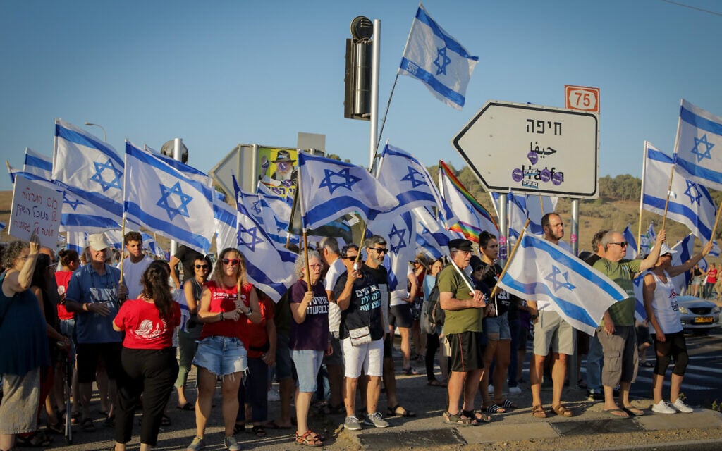 Israelis protest against the government's judicial overhaul, at the Nahalal Junction (Anat Hermony/Flash90) Israelis protest against the government's judicial overhaul, at the Nahalal Junction (Anat Hermony/Flash90)