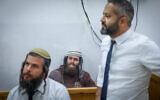 Elisha Yered, a suspect in the death of 19-year-old Palestinian Qusai Jamal Maatan in the West Bank village of Burqa on August 4, arrives for a hearing at the Jerusalem Magistrate's Court, August 5, 2023. (Chaim Goldberg/Flash90)