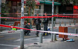 Police and other emergency personnel at the scene of a suspected terror attack in Tel Aviv on August 5, 2023. (Itai Ron/Flash90)