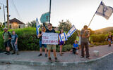 Israelis protest against the visit of Prime Minister Benjamin Netanyahu and his wife Sara in Moshav Neve Ativ, Golan Heights, August 7, 2023. (Ayal Margolin/Flash90)