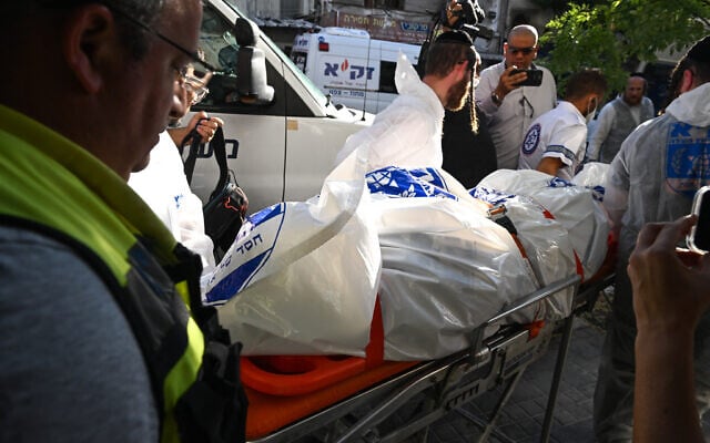Police at the scene where a body was found at an apartment in Haifa, August 9, 2023. (Flash90) Police at the scene where a body was found at an apartment in Haifa, August 9, 2023. (Flash90)