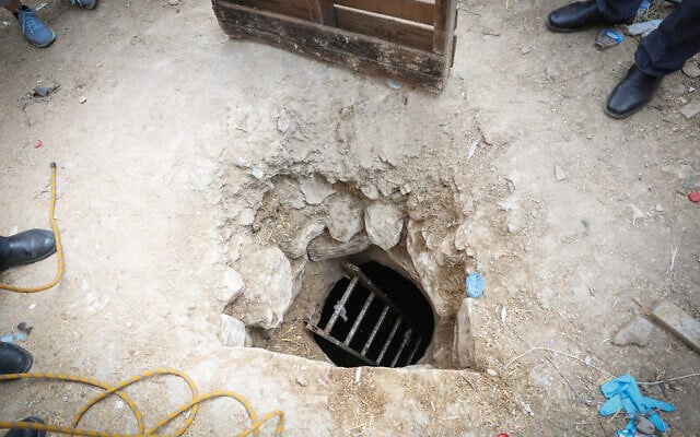 Police and rescue personnel at the scene where three people fell into an eight-meter-deep pit in Deir El Asad, northern Israel on August 13, 2023. (David Cohen/Flash90)