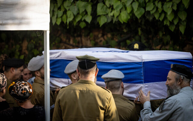 Friends and family carry the casket of IDF soldier Hillel Ofan at his funeral at the Mount Herzl military cemetery in Jerusalem, August 15, 2023. (Chaim Goldberg/FLASH90) Friends and family carry the casket of IDF soldier Hillel Ofan at his funeral at the Mount Herzl military cemetery in Jerusalem, August 15, 2023. (Chaim Goldberg/FLASH90)