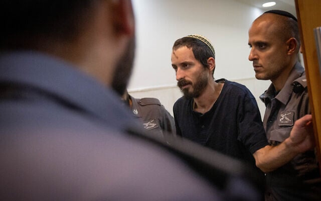 Yehiel Indore, who is suspected of shooting and killing 19-year-old Palestinian Qusai Jamal Matan in the West Bank village of Burqa, arrives for a Jerusalem District Court hearing on August 15, 2023. (Chaim Goldberg/Flash90) Yehiel Indore, who is suspected of shooting and killing 19-year-old Palestinian Qusai Jamal Matan in the West Bank village of Burqa, arrives for a Jerusalem District Court hearing on August 15, 2023. (Chaim Goldberg/Flash90)