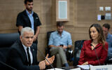Opposition leader Yair Lapid (left) and Yesh Atid MK Meirav Cohen at an emergency meeting following recent cases of gender inequality in public spaces, at the Knesset, in Jerusalem, August 16, 2023. (Yonatan Sindel/Flash90)