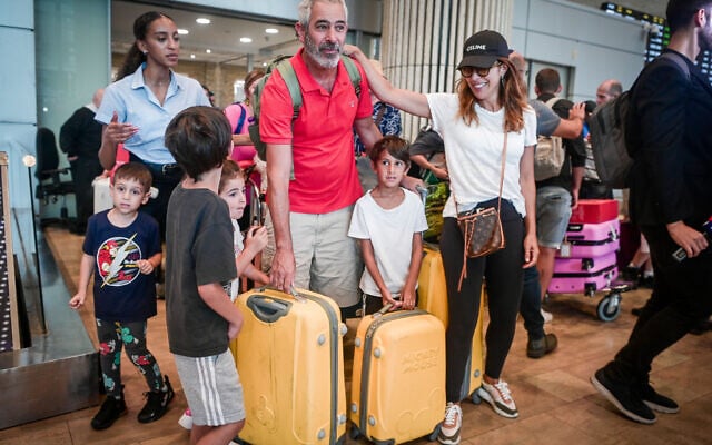 Israeli passengers who were on flight home from the Seychelles that made an emergency landing in Saudi Arabia, seen after their arrival on a replacement plane at Ben Gurion International Airport, August 29, 2023. (Avshalom Sassoni/Flash90) Israeli passengers who were on flight home from the Seychelles that made an emergency landing in Saudi Arabia, seen after their arrival on a replacement plane at Ben Gurion International Airport, August 29, 2023. (Avshalom Sassoni/Flash90)