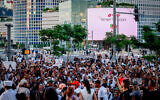 Activists protest in Tel Aviv on August 30, 2023, calling for justice for 4-year-old Rafael Adana, who was killed in a hit-and-run in Netanya in May. (Chaim Goldberg/Flash90)