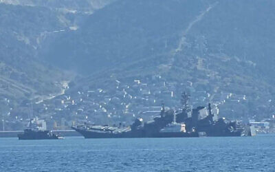 A Russian warship seen listing on its side after a Ukrainian sea drone attack on a Black Sea port. (Twitter/used in accordance with Clause 27a of the Copyright Law)