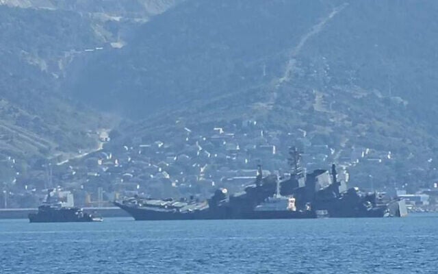 A Russian warship seen listing on its side after a Ukrainian sea drone attack on a Black Sea port. (Twitter/used in accordance with Clause 27a of the Copyright Law) A Russian warship seen listing on its side after a Ukrainian sea drone attack on a Black Sea port. (Twitter/used in accordance with Clause 27a of the Copyright Law)