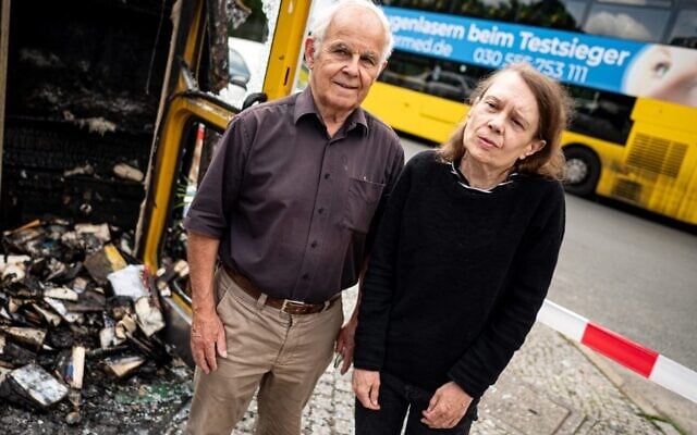 Konrad Kutt and Irena Aselmeier, founders of Germany's book box initiative, stand in front of the burned-out book box near the "Gleis 17" Holocaust memorial after an apparent arson attack. (Fabian Sommer/picture alliance via Getty Images via JTA) Konrad Kutt and Irena Aselmeier, founders of Germany's book box initiative, stand in front of the burned-out book box near the "Gleis 17" Holocaust memorial after an apparent arson attack. (Fabian Sommer/picture alliance via Getty Images via JTA)