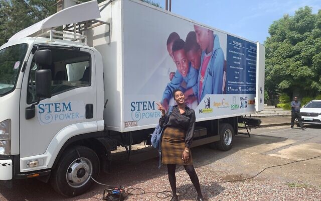 STEMpower social media guru Bereket Getachew poses in front of the pilot project mobile stem lab in Bishoftu, Ethiopia. (Amanda Borschel-Dan/ToI)