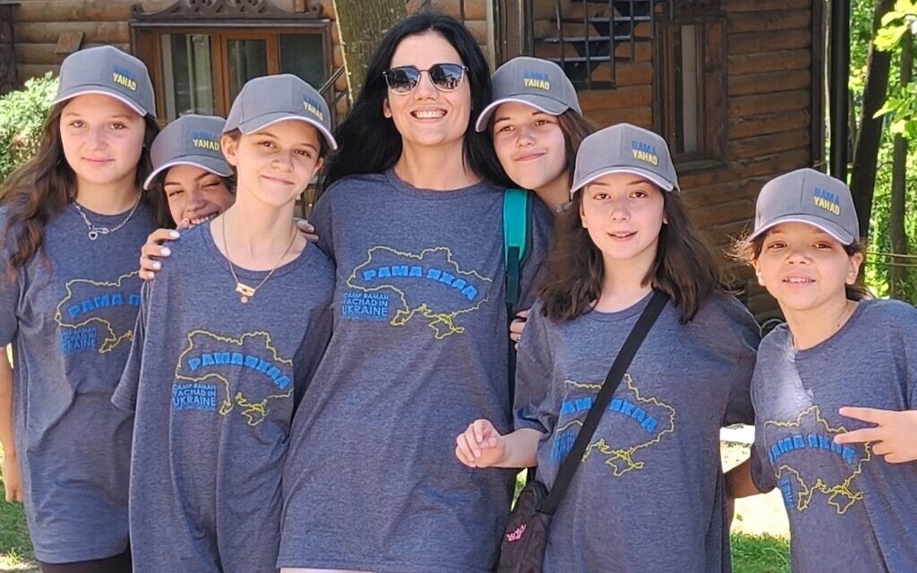 Campers and a counselor at Ramah Yachad pose in their 2023 T-shirts, showing an outline of Ukraine for the first session in the country since Russia invaded in 2022. (Courtesy Midreshet Schechter via JTA)