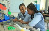 Fenet Gossa and Kalkidan Eshteu work on their EZ Registration project at the Foka STEMpower center in Bishoftu, Ethiopia, July 2023. (courtesy)