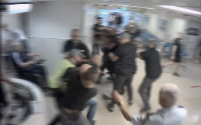 Scuffles between relatives of a murder victim and security guards at Rambam Medical Center in Haifa, August 9, 2023 (Screen grab used in accordance with Clause 27a of the Copyright Law) Scuffles between relatives of a murder victim and security guards at Rambam Medical Center in Haifa, August 9, 2023 (Screen grab used in accordance with Clause 27a of the Copyright Law)