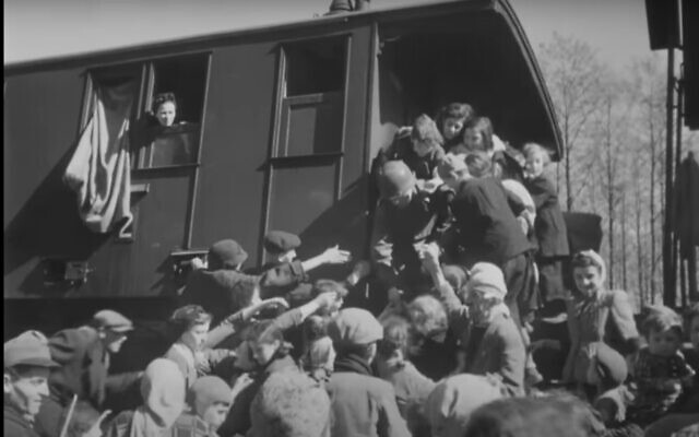 Screen capture from video of US soldiers helping Jewish prisoners liberated from a Nazi death train near Farsleben, Germany April 1945. (YouTube screenshot; used in accordance with Clause 27a of the Copyright Law)