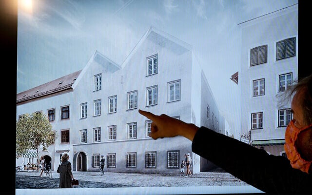 A man points his finger at a screen showing the chosen plan for the architectural redesign of Adolf Hitler's birth house, during a press conference at the Interior ministry in Vienna, Austria on June 2, 2020. (Joe Klamar/AFP) A man points his finger at a screen showing the chosen plan for the architectural redesign of Adolf Hitler's birth house, during a press conference at the Interior ministry in Vienna, Austria on June 2, 2020. (Joe Klamar/AFP)