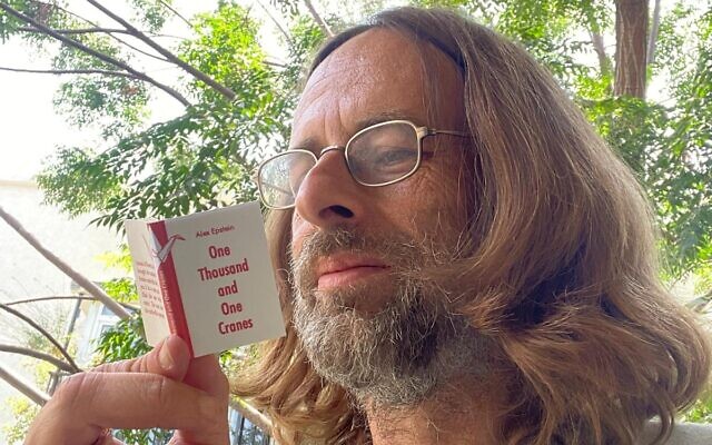Writer Alex Epstein with one of his handmade miniature novels (Courtesy Alex Epstein)