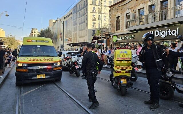 First responders at the scene in Jerusalem where a woman was hit by a police vehicle on the light rail tracks, August 24, 2023. (MDA) First responders at the scene in Jerusalem where a woman was hit by a police vehicle on the light rail tracks, August 24, 2023. (MDA)