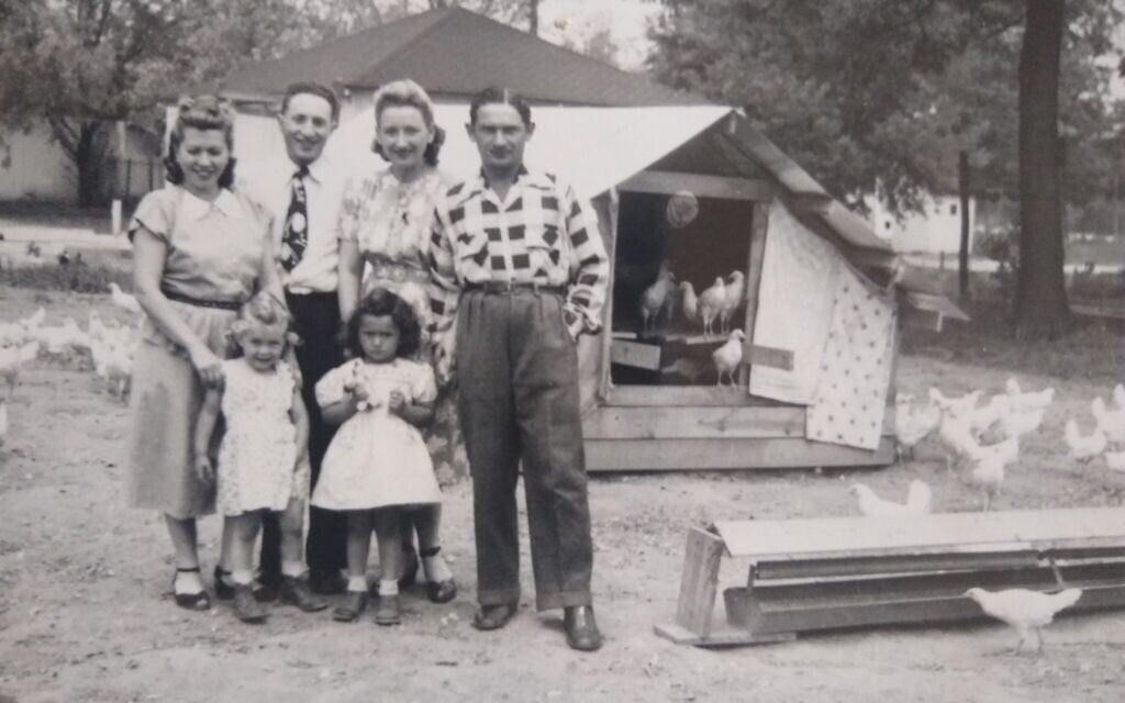 Two Holocaust survivor families on the Vineland, New Jersey-area poultry farm they jointly purchased in 1947. From left to right: Dina and Dorothy Liverant, standing next to a visitor, with Ruth, Bronia, and Nuchim Grin, Seth Stern's mother and grandparents. (Photo courtesy of Stern)