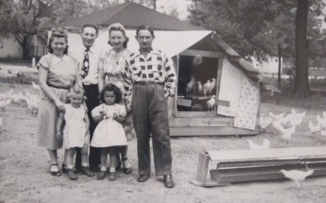 Two Holocaust survivor families on the Vineland, New Jersey-area poultry farm they jointly purchased in 1947. From left to right: Dina and Dorothy Liverant, standing next to a visitor, with Ruth, Bronia, and Nuchim Grin, Seth Stern's mother and grandparents. (Photo courtesy of Stern)