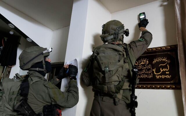 IDF combat engineering forces take measurements at the home of a Palestinian accused of carrying out a deadly shooting attack near Hebron, early August 23, 2023, (Israel Defense Forces) IDF combat engineering forces take measurements at the home of a Palestinian accused of carrying out a deadly shooting attack near Hebron, early August 23, 2023, (Israel Defense Forces)