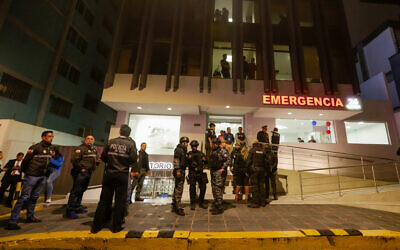 Police guard a hospital where several injured people were taken after an attack against presidential candidate Fernando Villavicencio in Quito, Ecuador, August 9, 2023. (AP Photo/Juan Diego Montenegro)