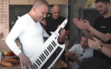 Performers dance in the video for the song 'Omelette Bread in Netanya' (Screenshot from YouTube via JTA)