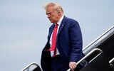 Former US president Donald Trump arrives at Ronald Reagan Washington National Airport in Arlington, Virginia, August 3, 2023. (AP Photo/Alex Brandon)