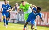 Wolfsburg's Mattias Svanberg, left, fights for the ball against TUS Makkabi's Brian Petnga during the German Soccer Cup match between TuS Makkabi and VfL Wolfsburg at Mommsenstadion stadium, Berlin, Sunday Aug. 13, 2023. (Andreas Gora/dpa via AP)