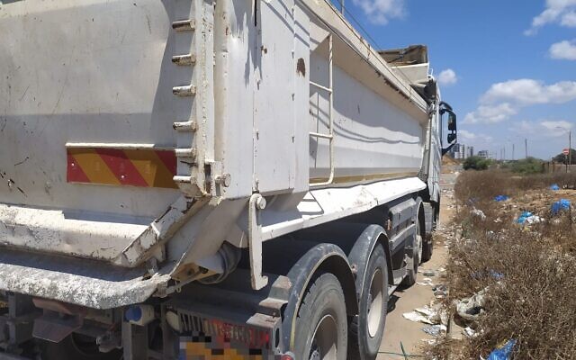 One of 12 vehicles seized by the Environmental Protection Ministry's Green Police and the Tel Aviv District fraud unit on suspicion that they were used for the illegal dumping of building waste in Ramat Hasharon, central Israel, August 8, 2023 (Green Police)