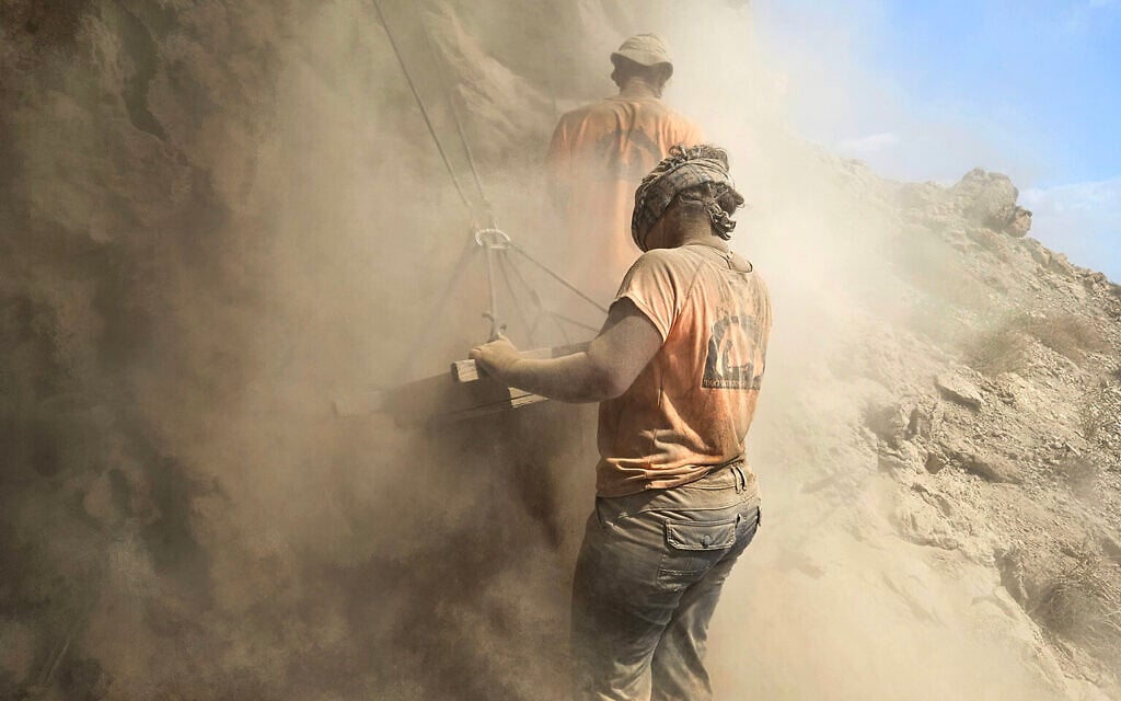 Archaeologists excavate the cave where four Roman swords were discovered in the Judean desert. (Hagay Hamer/IAA)
