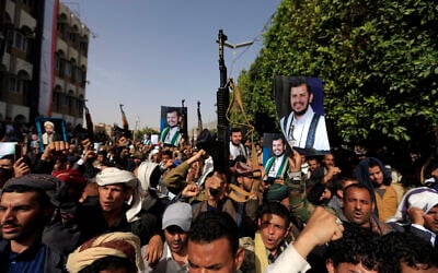 Supporters of Yemen's Houthi rebels raise portraits of their leader Abdul Malik Al-Houthi during a rally in the capital Sanaa on June 3, 2022. (Mohammed Huwais/AFP) Supporters of Yemen's Houthi rebels raise portraits of their leader Abdul Malik Al-Houthi during a rally in the capital Sanaa on June 3, 2022. (Mohammed Huwais/AFP)
