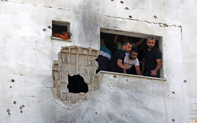 Palestinians inspect a damaged house following an Israel military raid in the Palestinian town of Aqaba, near Tubas in the West Bank, on September 1, 2023. (Jaafar Ashtiyeh / AFP) Palestinians inspect a damaged house following an Israel military raid in the Palestinian town of Aqaba, near Tubas in the West Bank, on September 1, 2023. (Jaafar Ashtiyeh / AFP)