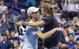 Germany's Alexander Zverev (R) and Italy's Jannik Sinner (L) hug at the net after Zverev won the US Open tennis tournament men's singles round of 16 match at the USTA Billie Jean King National Tennis Center in New York City, September 5, 2023. (COREY SIPKIN/AFP)